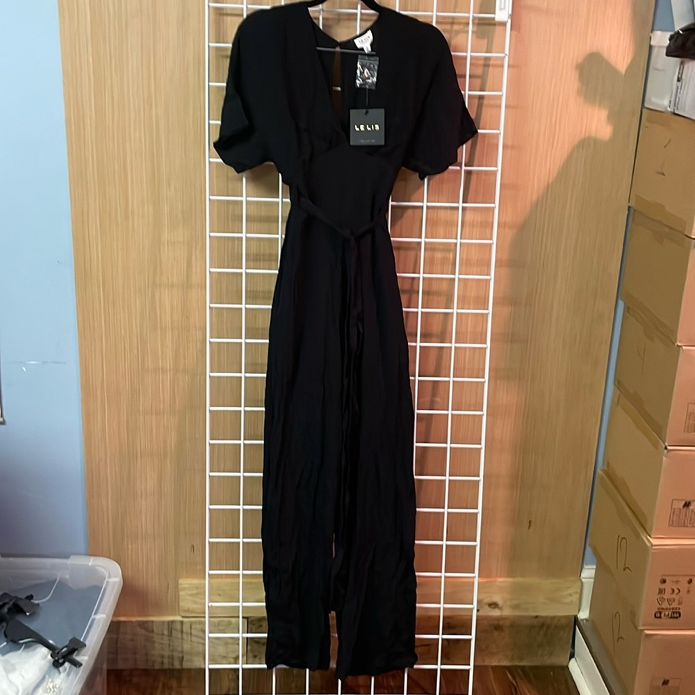 Le Lis black pantsuit. Low cut crisscross top.